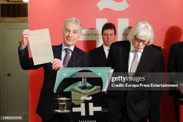 Jorge Maronna speaks next to Carlos López Puccio and Horacio "Tato" Turano of Les Luthiers attend 'Les Luthiers' tribute at The Cervantes Institute...