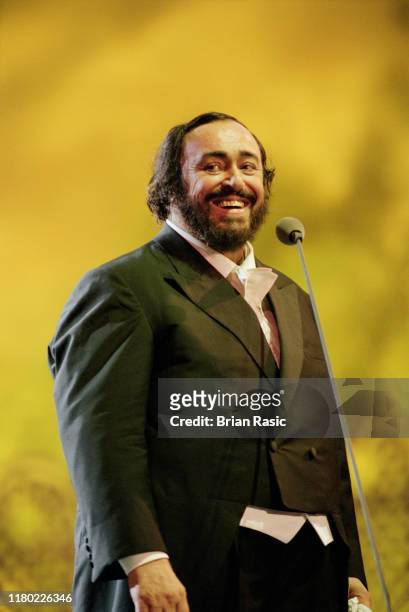 Italian operatic tenor Luciano Pavarotti performs live on stage during the Pavarotti and Friends for War Child benefit concert at Parco Novi Sad in...