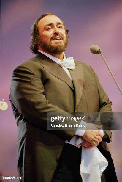 Italian operatic tenor Luciano Pavarotti performs live on stage during the Pavarotti and Friends for War Child benefit concert at Parco Novi Sad in...