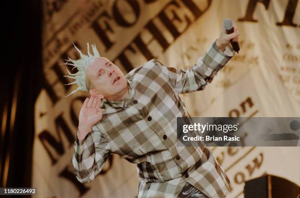 English singer, songwriter and musician John Lydon performs live on stage with punk group Sex Pistols at Finsbury Park in London during the band's...