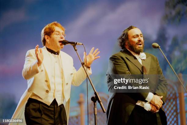 Italian operatic tenor Luciano Pavarotti performs live on stage with English singer Elton John during the Pavarotti and Friends for War Child benefit...