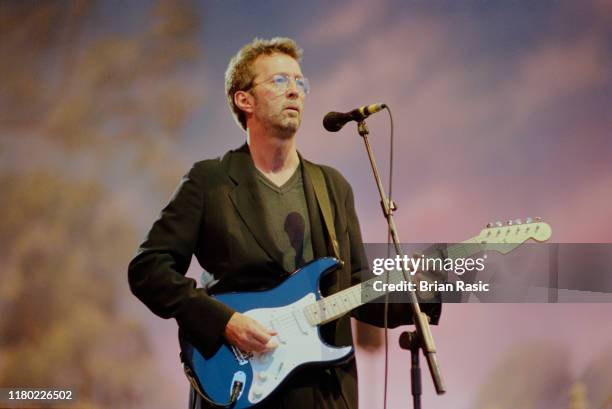 English rock guitarist Eric Clapton performs live on stage during the Pavarotti and Friends for War Child benefit concert at Parco Novi Sad in...