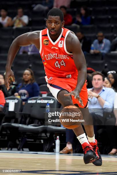 Andrew Nicholson of the Guangzhou Long-Lions dribbles against the Washington Wizards during the first half at Capital One Arena on October 9, 2019 in...