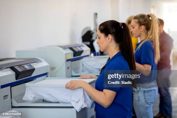 coworkers in printing factory - computer printing stock pictures, royalty-free photos & images