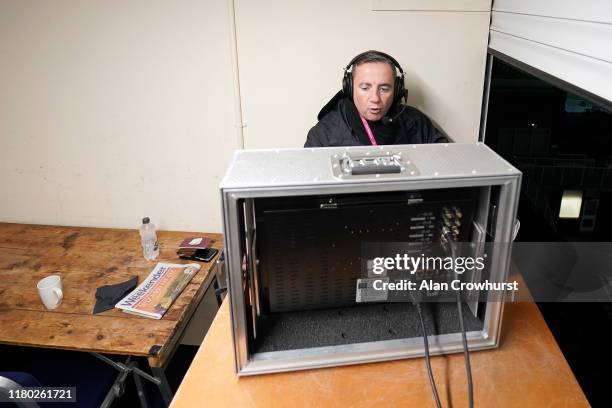Racecourse commentator John Hunt calls them home at Kempton Park Racecourse on October 10, 2019 in Sunbury, England.