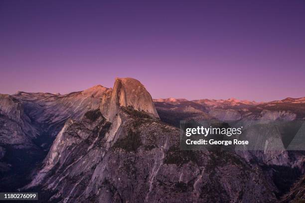 The iconic Half Dome is viewed from Glacier Point at sunset on October 5 in Yosemite National Park, California. With the arrival of fall, the tens of...