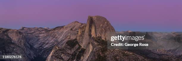 The iconic Half Dome is viewed from Glacier Point at sunset on October 5 in Yosemite National Park, California. With the arrival of fall, the tens of...