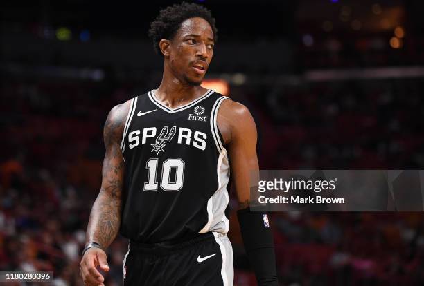 DeMar DeRozan of the San Antonio Spurs in action against the Miami Heat during the first half of the preseason game at American Airlines Arena on...