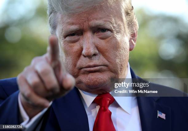 President Donald Trump answers questions before boarding Marine One while departing the White House on October 10, 2019 in Washington, DC. Trump is...