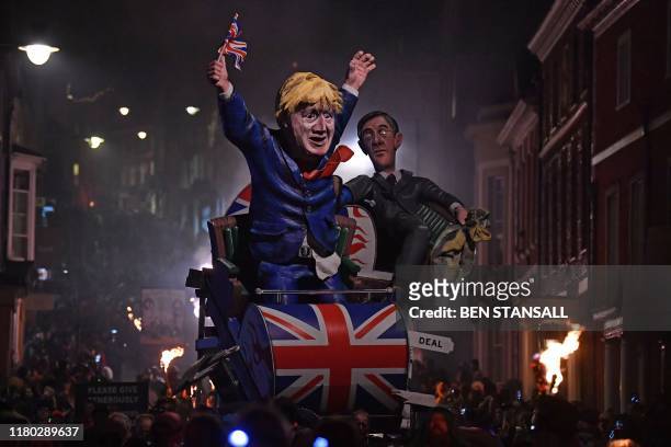 Effigies of Britain's Leader of the House of Commons Jacob Rees-Mogg and Britain's Prime Minister Boris Johnson are paraded through the streets of...
