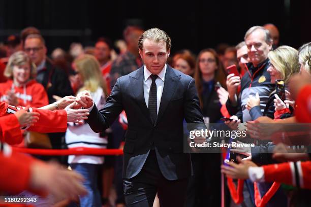 Patrick Kane of the Chicago Blackhawks greets fans during a red carpet event prior to the home opening game against the San Jose Sharks at United...