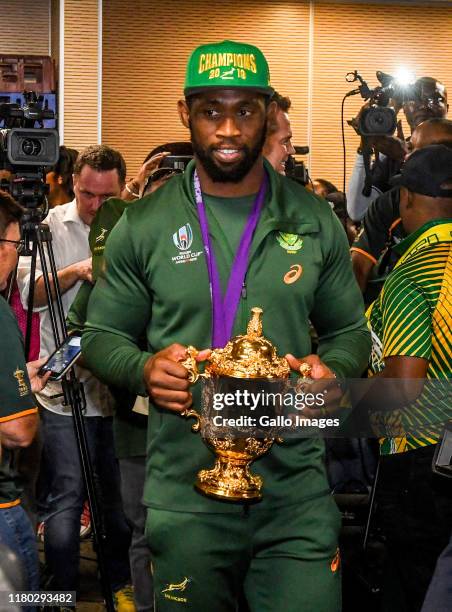 Siya Kolisi of the Springboks poses with the Webb Ellis Cup during the South African national rugby team arrival media conference at OR Tambo...