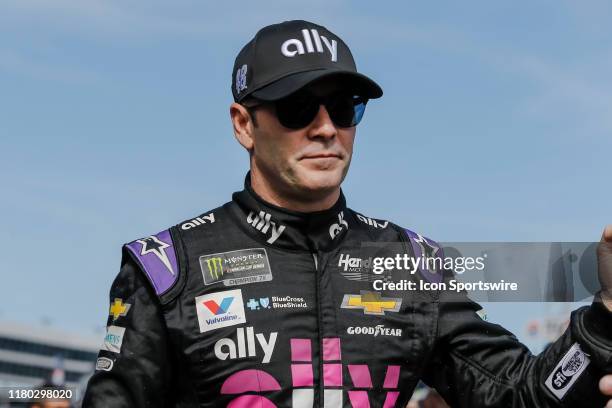 Monster Energy NASCAR Cup Series driver Jimmie Johnson walks through the crowd during driver introductions before the Monster Energy NASCAR Cup...