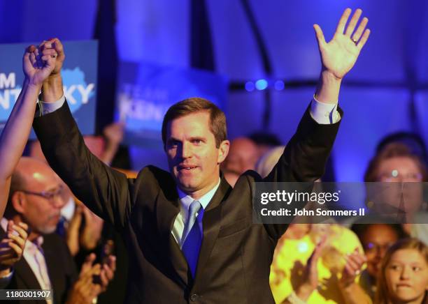 Apparent Gov.-elect Andy Beshear celebrates with supporters after voting results showed the Democrat holding a slim lead over Republican Gov. Matt...