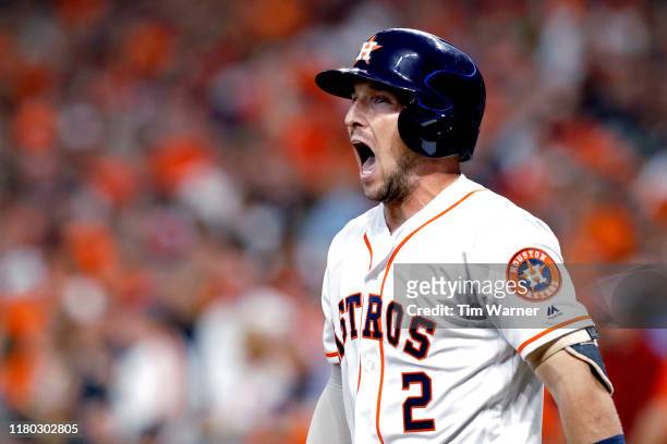 Alex Bregman of the Houston Astros celebrates after he scores a run against the Tampa Bay Rays during the first inning in game five of the American...