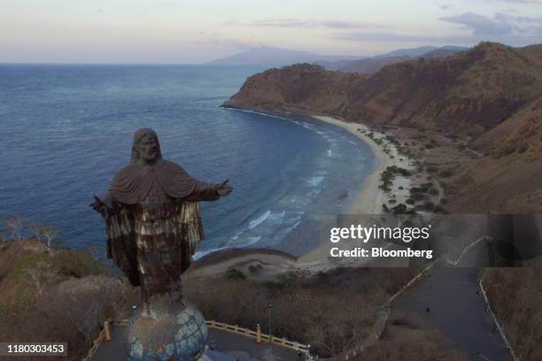 The Christ the King Statue stands in this aerial photograph taken in Dili, Timor-Leste, on Monday, Aug. 26, 2019. Twenty years on from a referendum...