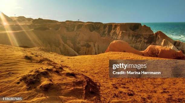 cliffs of canoa quebrada beach - canoa quebrada stock pictures, royalty-free photos & images