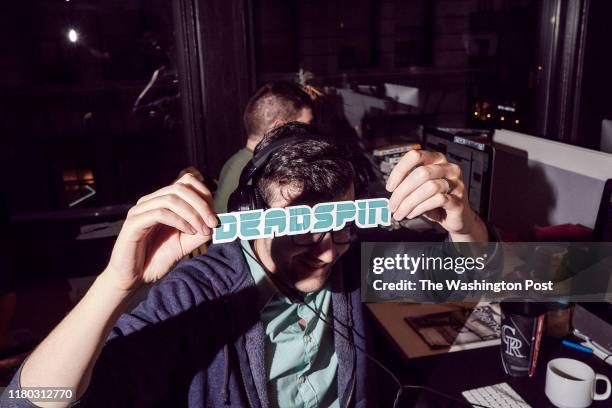 An employee of the website Deadspin shows a logo at their office in Manhattan, New York on November 1, 2018.