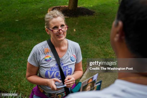 Juli Briskman, the Democratic nominee for Supervisor of Loudoun County's Algonkian District, chats with Hari Moosani as she campaigns door-to-door in...