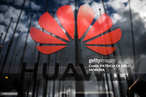 The logo of Chinese telecom giant Huawei is pictured during the Web Summit in Lisbon on November 6, 2019. - Europe's largest tech event Web Summit is...