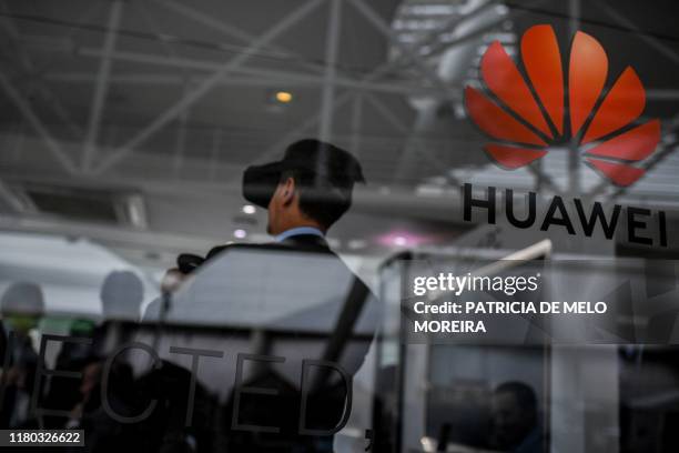 People visit the stand of Chinese telecom giant Huawei during the Web Summit in Lisbon on November 6, 2019. - Europe's largest tech event Web Summit...