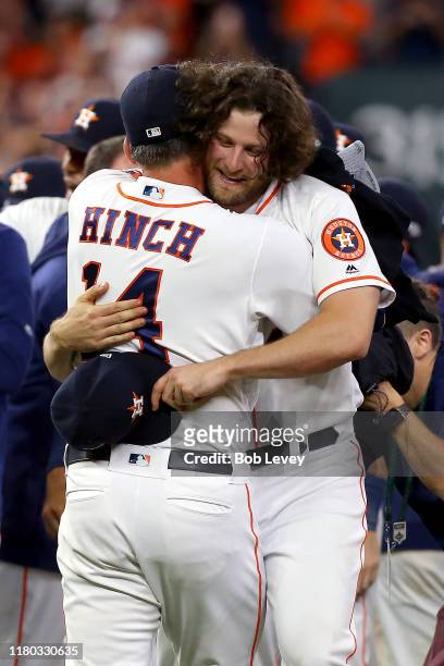 Gerrit Cole and AJ Hinch of the Houston Astros embrace after their teams 6-1 win over the Tampa Bay Rays in game five of the American League Division...