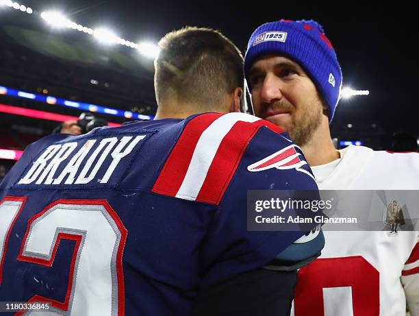 Tom Brady of the New England Patriots shakes hands with Eli Manning of the New York Giants after their game at Gillette Stadium on October 10, 2019...