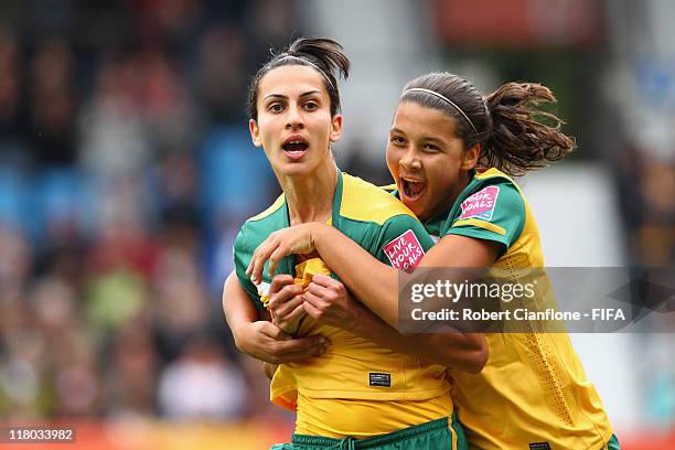 Leena Khamis of Australia celebrates her goal with teammate Samantha Kerr during the FIFA Women's World Cup 2011 Group D match between Australia and...