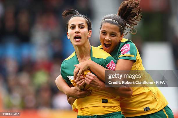 Leena Khamis of Australia celebrates her goal with teammate Samantha Kerr during the FIFA Women's World Cup 2011 Group D match between Australia and...