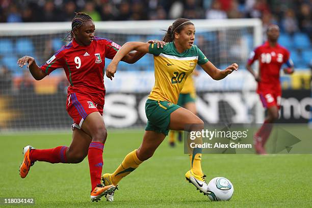 Samantha Kerr of Australia Dorine is challenged by Dorine of Equatorial Guinea during the FIFA Women's World Cup 2011 Group D match between Australia...