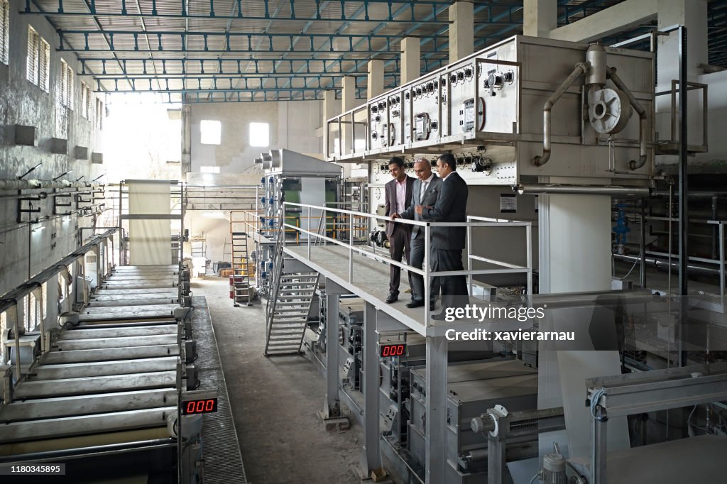 Elevated View of Indian CEO and Senior Factory Managers