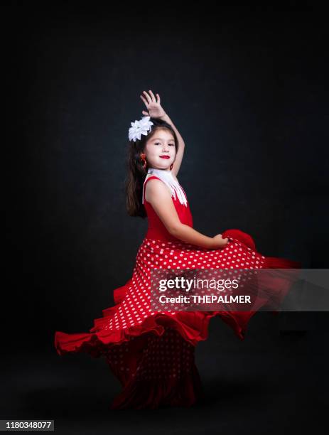 little girl dancing flamenco - flamenco dancing stock pictures, royalty-free photos & images