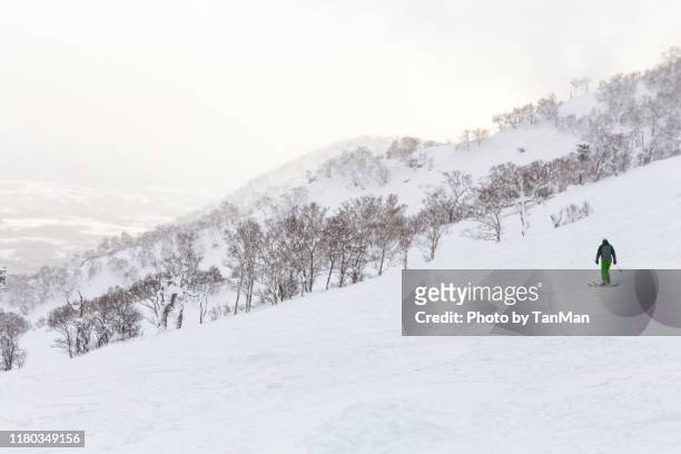 at the slopes. winter in niseko, japan. - cottage ストックフォトと画像