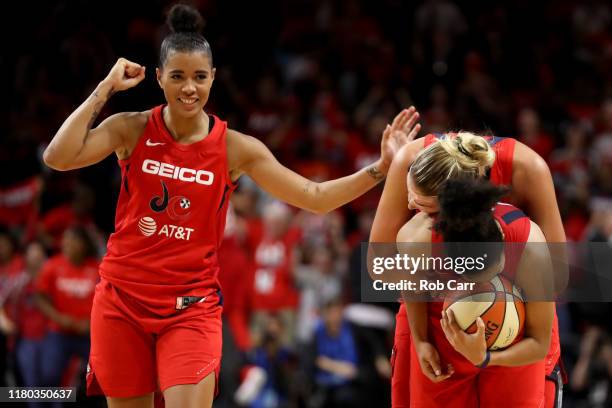 Natasha Cloud, , Elena Delle Donne and Kristi Toliver of Washington Mystics celebrate during the closing seconds of their win over the Connecticut...