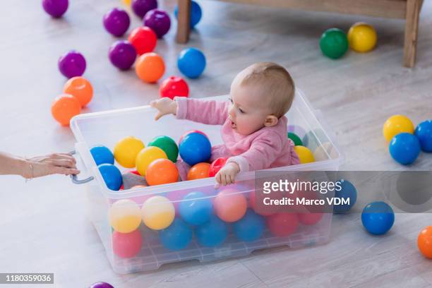 she's in rainbow heaven - ball pit stock pictures, royalty-free photos & images