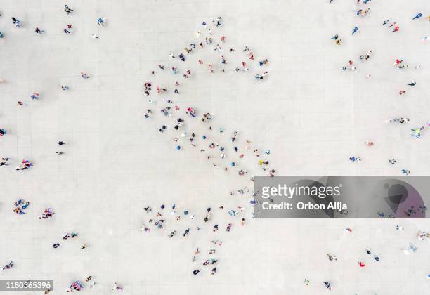 crowd forming a dollar shape - crowd of people from above stock pictures, royalty-free photos & images