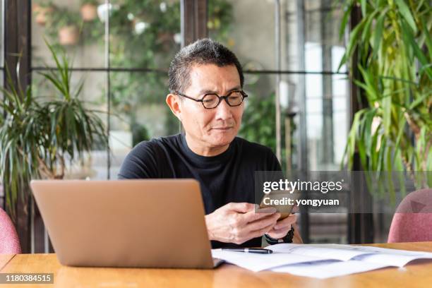 chinese architect working at home - asian man looking up stock pictures, royalty-free photos & images