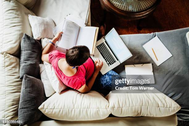 aerial view of pregnant mother working from home - family paperwork stock pictures, royalty-free photos & images