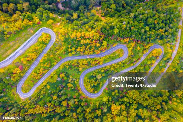 aerial view of winding road on mountain in autumn - october landscape stock pictures, royalty-free photos & images