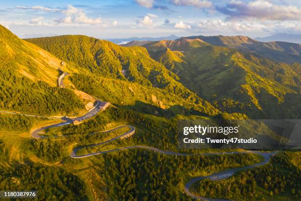 aerial view of winding road on mountain in autumn - gunma prefecture imagens e fotografias de stock