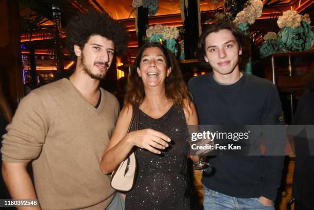 Martin Nigard, Sandrine Taddei and nephew Diego Taddei attend the "Prix Double Dôme 2019" music/litterature and Art Award at Brasserie Le Dôme on...