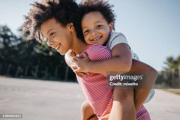 the fun never stops when they’re together - sibling hugging stock pictures, royalty-free photos & images