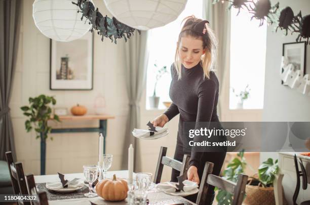 preparing table for halloween lunch - witch hat stock pictures, royalty-free photos & images