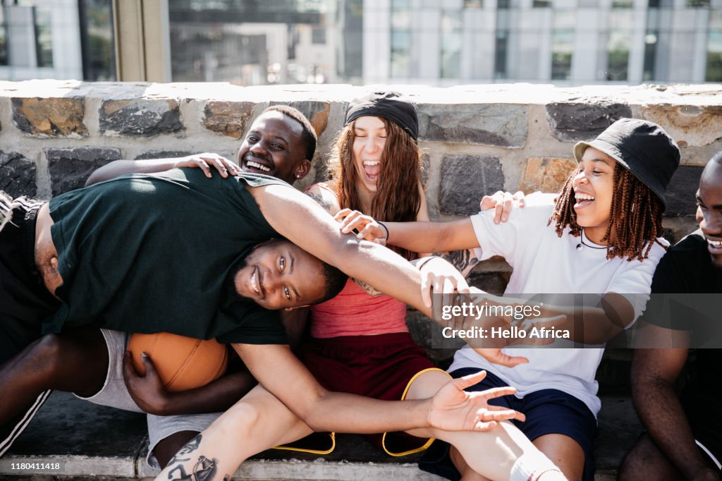 Young group enjoying enjoying horsing around