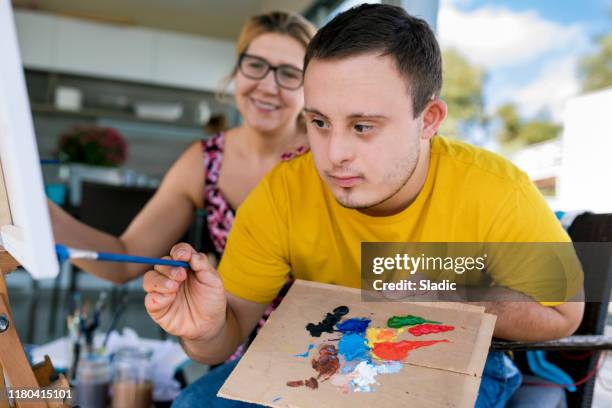 teenager artist with down syndrome - international day two stock pictures, royalty-free photos & images