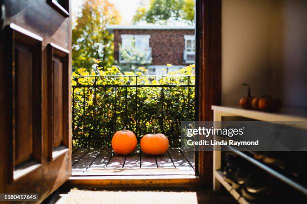 two pumpkins on a porch - front porch no people stock pictures, royalty-free photos & images