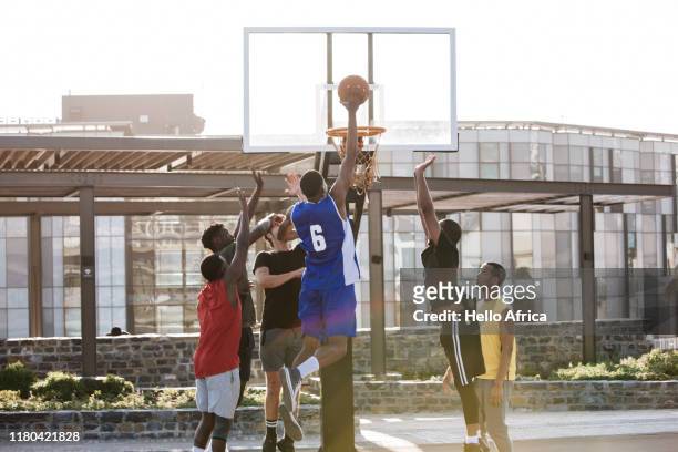 Basketball player about to score a hoop