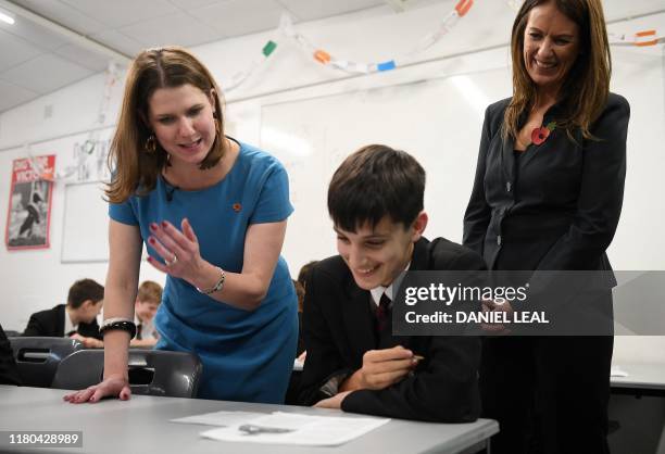 Liberal Democrats leader Jo Swinson reacts as she takes part in a science lesson with pupils from in Hinchley Wood School in north west London on...