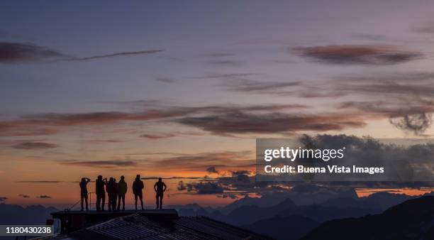 people watching sunset in the mountains - watching sunset stock pictures, royalty-free photos & images