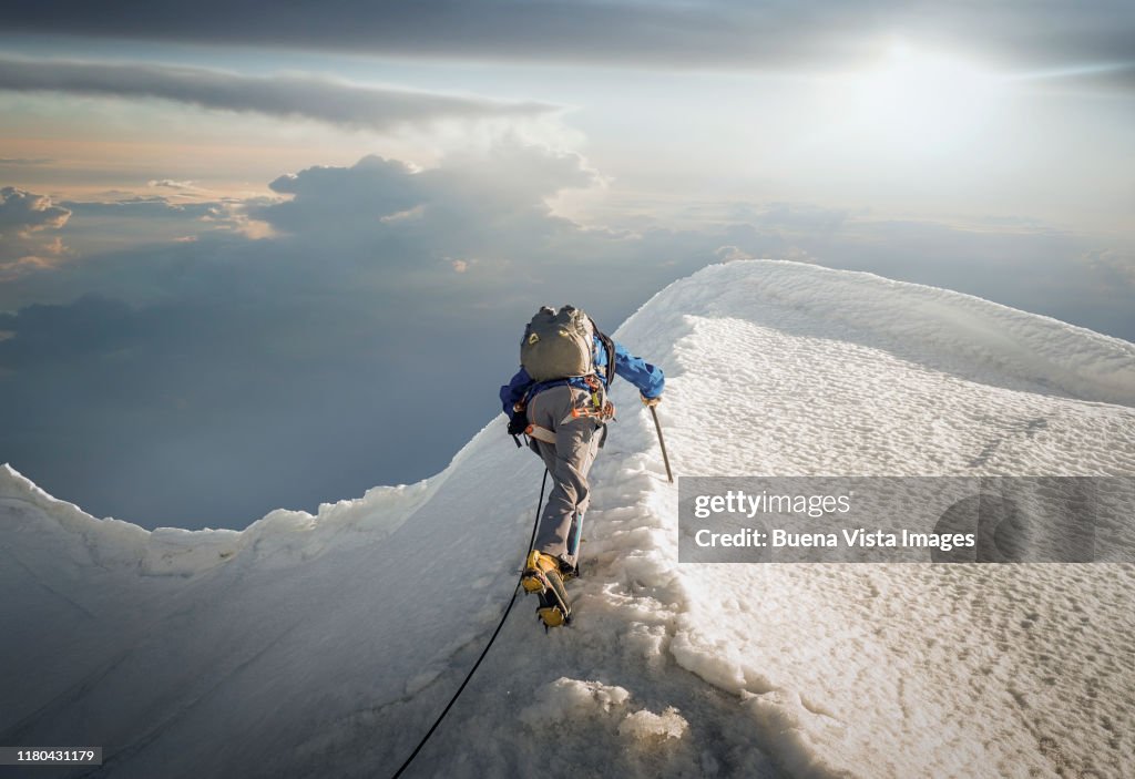 Climber on a snowy ridge